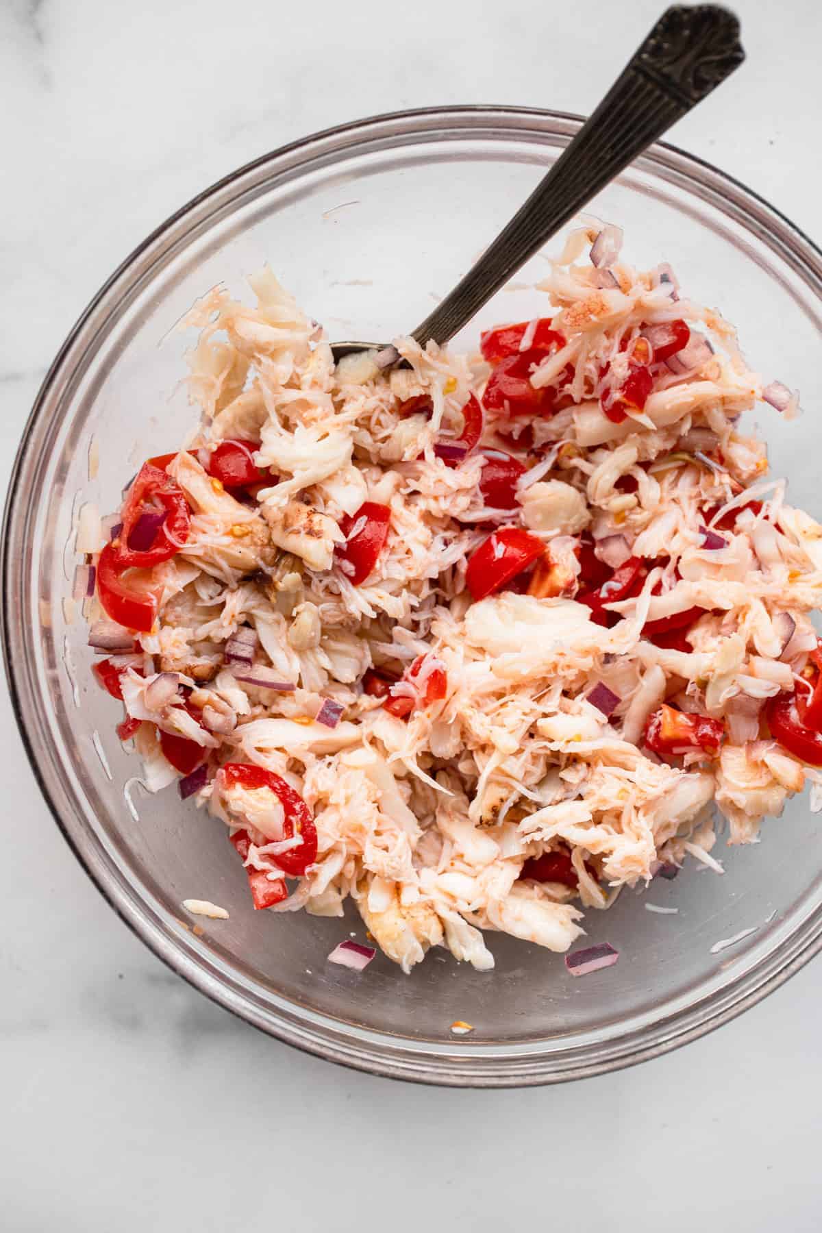 top view of crab salad being mixed for avocado