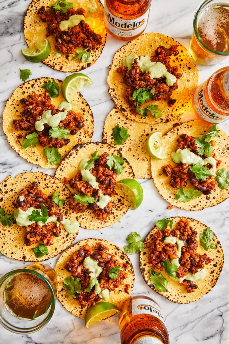 Cauliflower Tacos - SO PERFECT FOR TACO NIGHT! Completely vegetarian and so easy to make, topped with the best avocado crema sauce. SO GOOD.