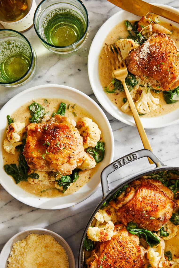 Creamy Chicken and Cauliflower - Tender, juicy golden-brown chicken cooked in a heavenly cream sauce with roasted cauliflower + baby spinach!