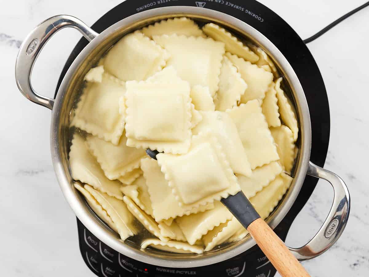 Cooked ravioli in the pot.