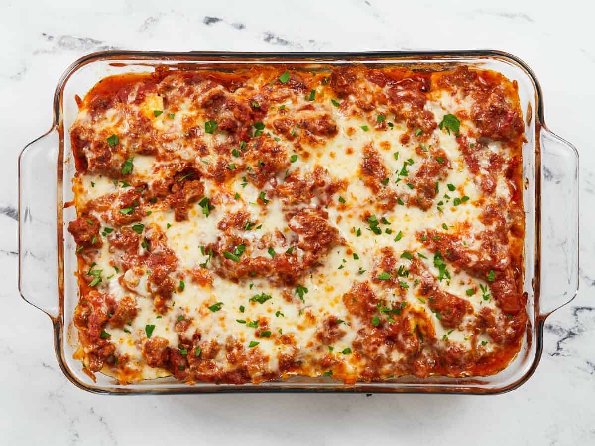 Finished baked ravioli topped with parsley.