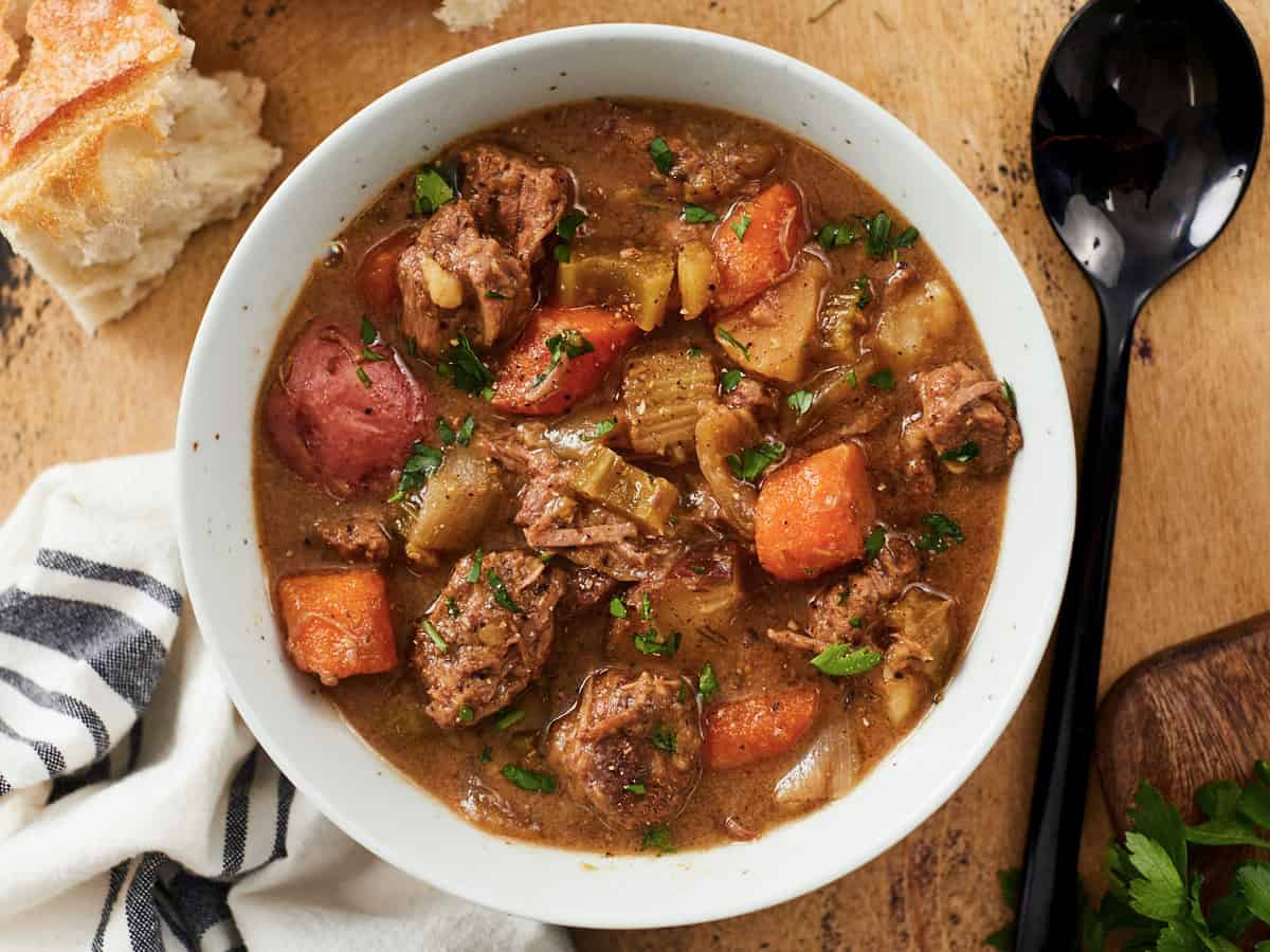 Close up overhead view of beef stew in a bowl.