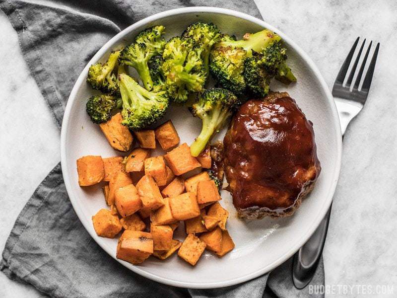 Make an entire dinner for two at one time with this fast and easy Sheet Pan BBQ Meatloaf Dinner. Perfect for meal prep! BudgetBytes.com