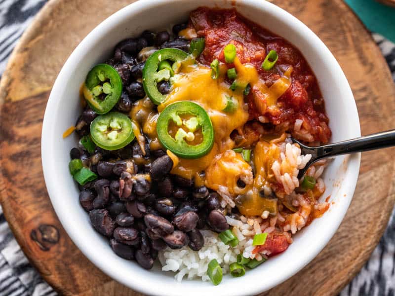 Close up overhead shot of a poor man's burrito bowl with melted cheese