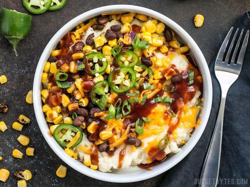 Creamy potatoes make the perfect base for a pile of colorful and flavorful toppings in these Loaded Mashed Potato Bowls. Perfect for meal prep! BudgetBytes.com