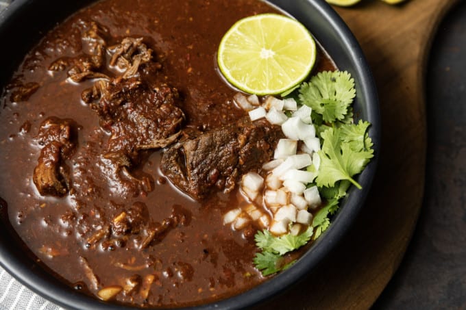 Instant Pot Birria makes fast work of the complex, rich, flavourful Mexican stewed or braised meat that is Birria. While traditional birria is made with goat marinated and then simmered for hours, our version of “birria de res” is done in a fraction of the time and made with more readily available beef.