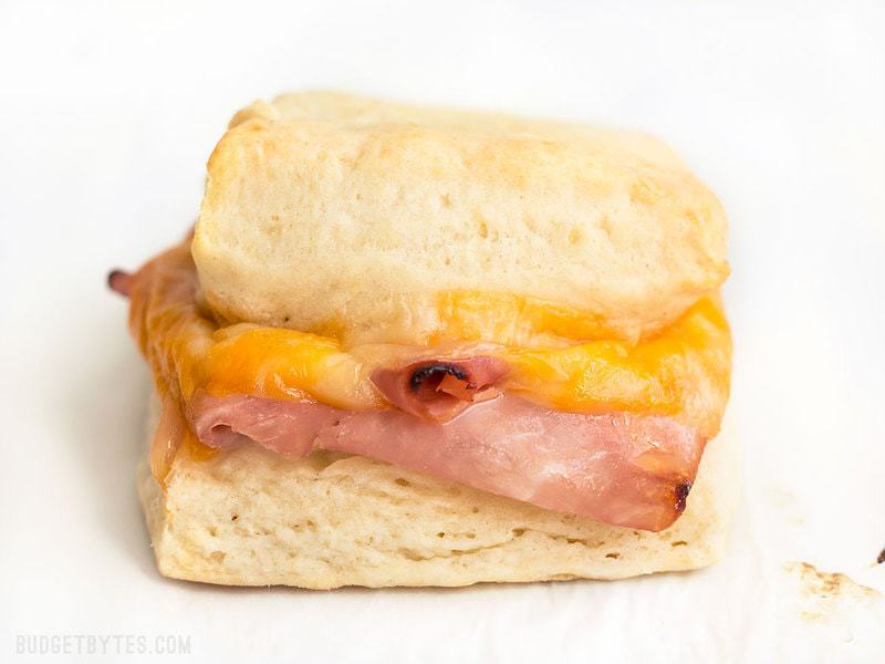 These Ham and Cheese Biscuits are a super indulgent, yet super easy treat for your weekend breakfast or to serve guests. BudgetBytes.com