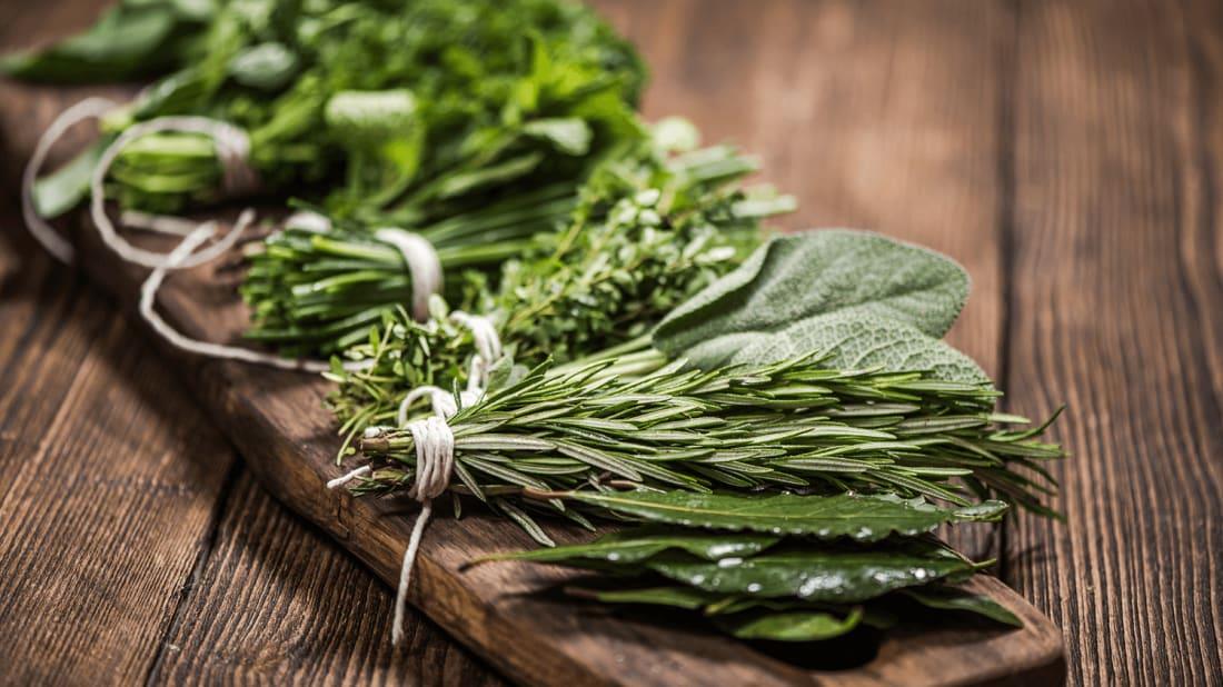 On sunny spring day in the village, two young women gathered herbs from the yard and prepared lavash