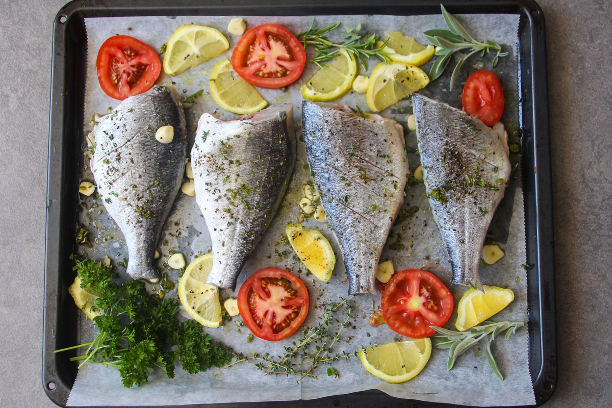 Using herbs to season fish dishes