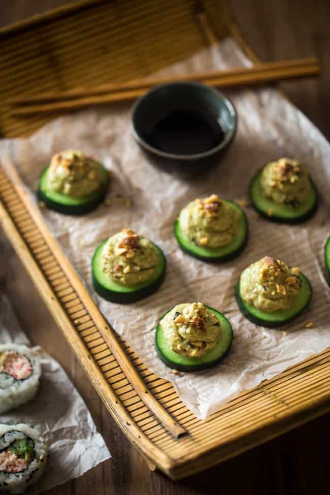 Low Carb California Roll Sushi Bites - Made of creamy Greek yogurt, avocado and crab meat and topped on a cucumber. They're a healthy, low carb and gluten free snack, or appetizer, that tastes like an California Roll, for only 40 calories! | Foodfaithfitness.com | @FoodFaithFit