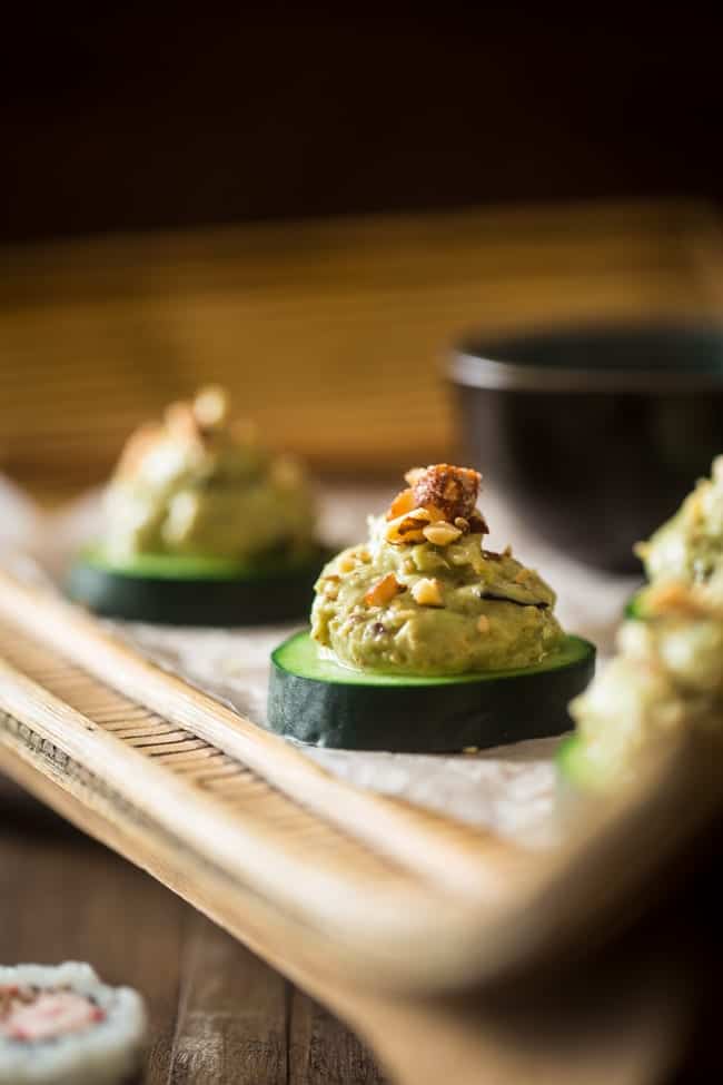 Low Carb California Roll Sushi Bites - Made of creamy Greek yogurt, avocado and crab meat and topped on a cucumber. They're a healthy, low carb and gluten free snack, or appetizer, that tastes like an California Roll, for only 40 calories! | Foodfaithfitness.com | @FoodFaithFit