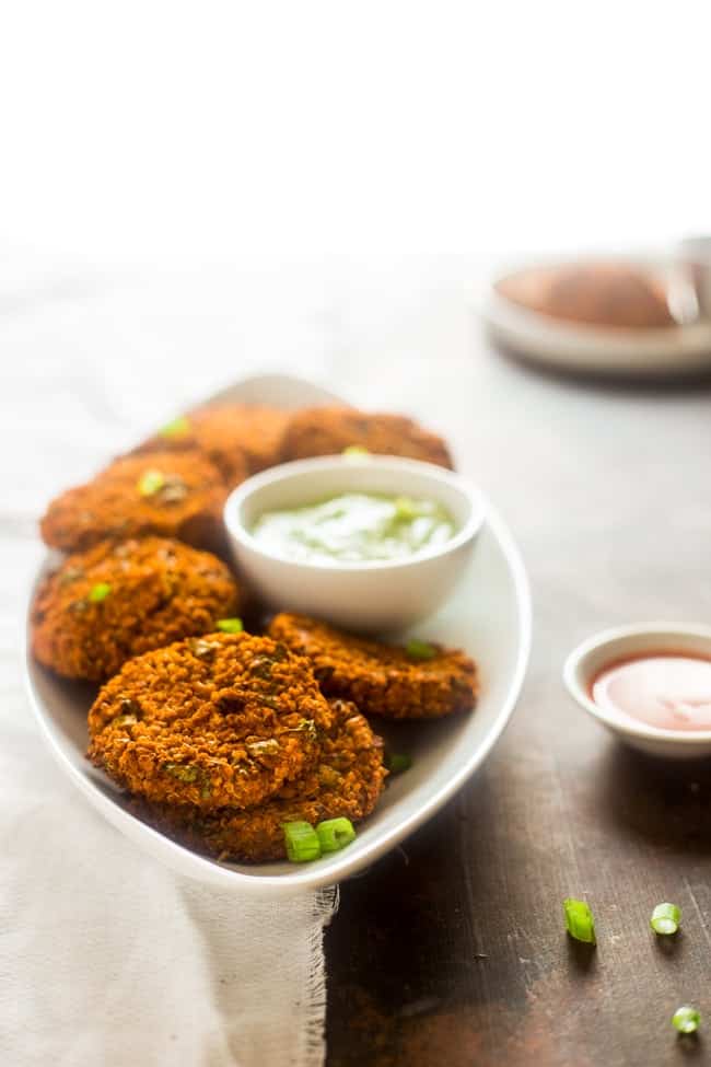 Vegan Buffalo Patties with Avocado Dip - These patties taste just like buffalo chicken, but they're totally meat free and made with cauliflower and quinoa! They're a spicy, crunchy and creamy appetizer for game day! | Foodfaithfitness.com | @FoodFaithFit