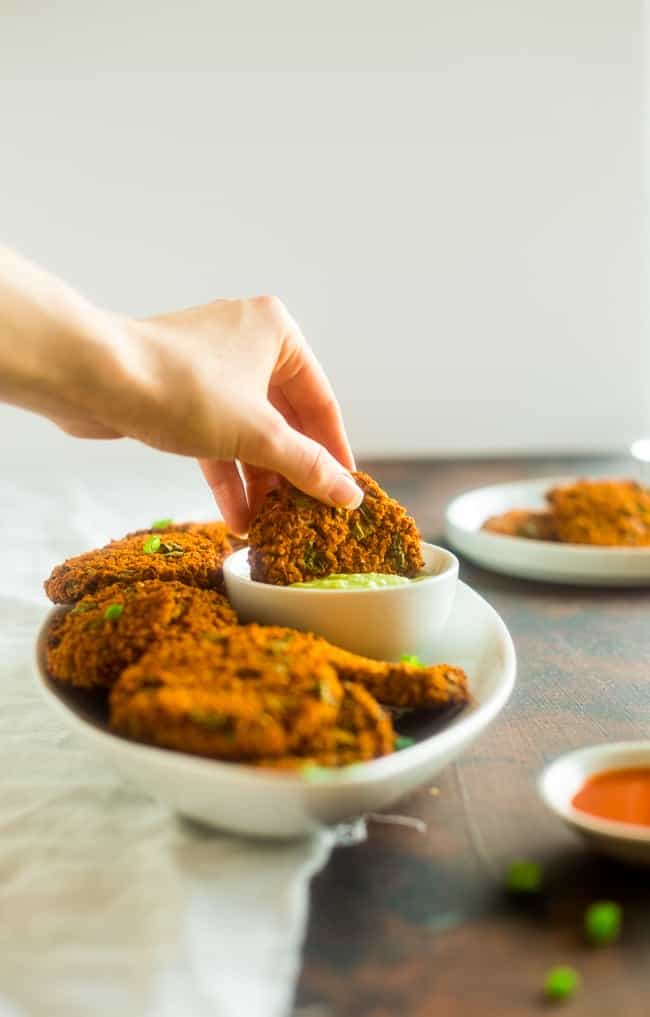 Vegan Buffalo Patties with Avocado Dip - These patties taste just like buffalo chicken, but they're totally meat free and made with cauliflower and quinoa! They're a spicy, crunchy and creamy appetizer for game day! | Foodfaithfitness.com | @FoodFaithFit