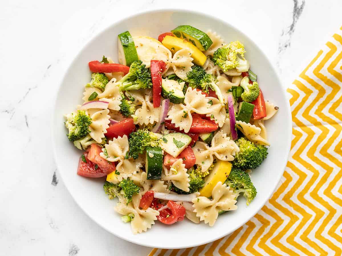 Overhead view of a bowl full of summer vegetable pasta salad