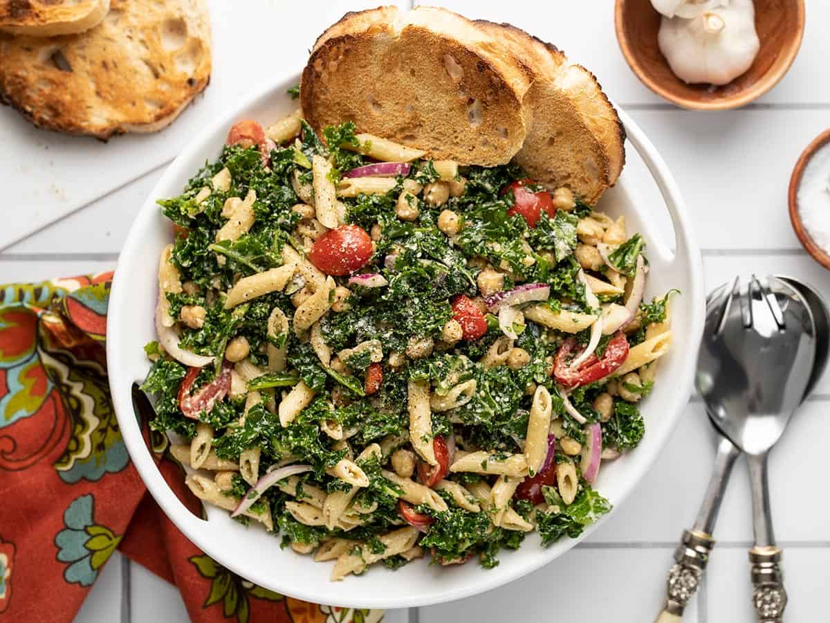 Overhead view of the serving bowl full of kale pasta salad.