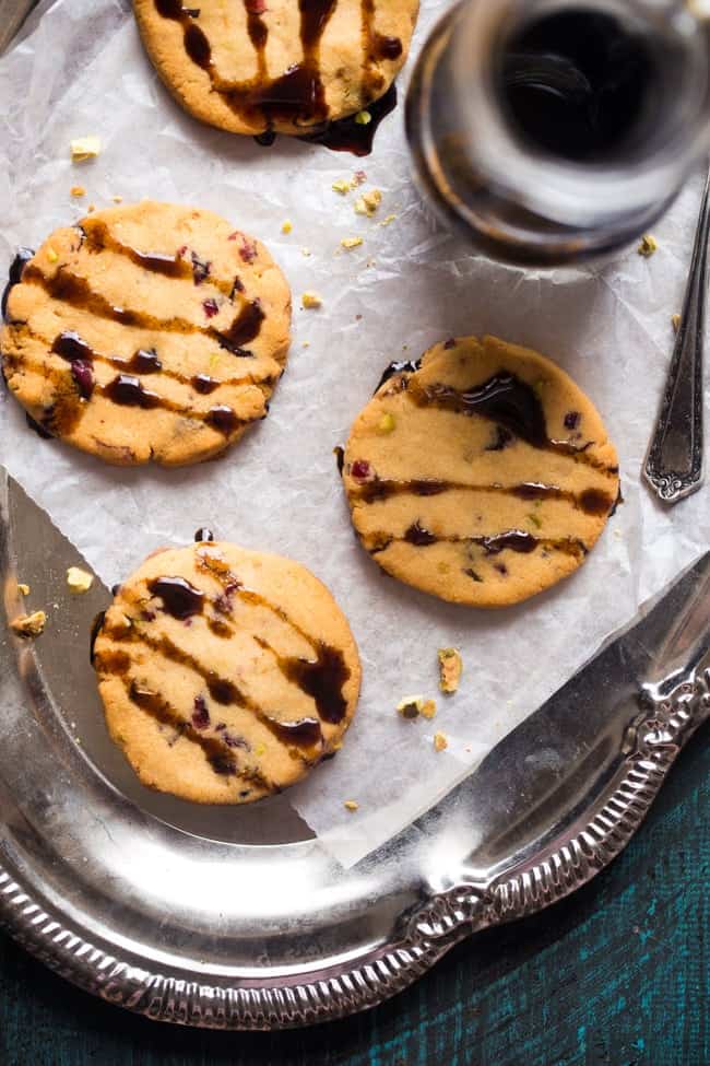 Vegan + Paleo Cranberry Pistachio Shortbread Cookies with Balsamic Reduction - Gluten free shortbread cookies with crunchy pistachios, chewy cranberries and tangy balsamic reduction! They're a healthy cookie for Christmas! | Foodfaithfitness.com | @FoodFaithFit