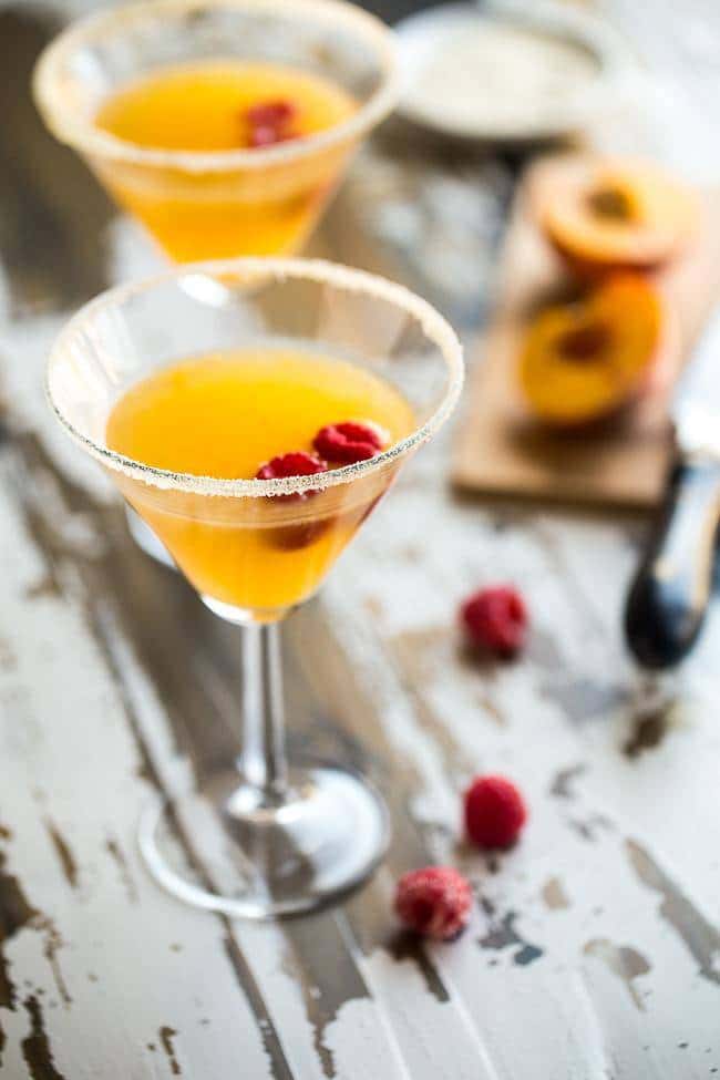 Skinny Raspberry Peach Martini - An easy, sugar free martini with only 150 calories! Perfect for summer entertaining! | Foodfaithfitness.com | @FoodFaithFit