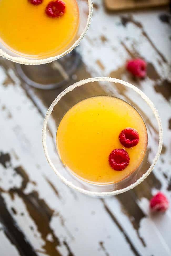 Skinny Raspberry Peach Martini - An easy, sugar free martini with only 150 calories! Perfect for summer entertaining! | Foodfaithfitness.com | @FoodFaithFit