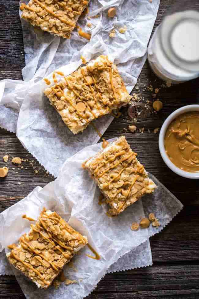 Healthier Oatmeal Crumble Peanut Butter Cheesecake Bars - SO easy to make and always a hit at gatherings! So creamy that you would never know they're lightened up with Greek yogurt and whole wheat flour! | Foodfaithfitness.com | @FoodFaithFit