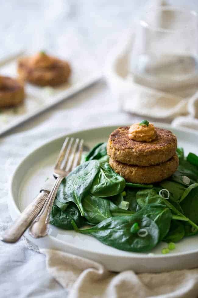 6 Ingredient Vegan Cauliflower Fritters With Hummus - Chickpeas and cauliflower are blended together, pan fried and topped with hummus so they're crispy on the outside and creamy on the inside. A quick, easy and healthy meatless Monday meal for under 350 calories! | Foodfaithfitness.com | @FoodFaithFit