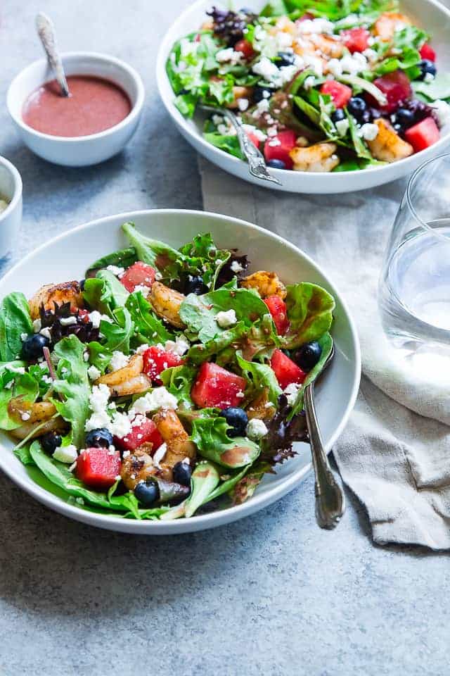 Watermelon Feta Salad with Cajun Shrimp - This easy Summer salad has spicy notes of Cajun shrimp and sweet berries! It's a crowd-pleasing, light and healthy, gluten free meal that is only 350 calories! | Foodfaithfitness.com | @FoodFaithFit