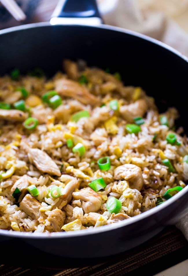 Easy Chicken Fried Rice - This chicken fried rice is better than takeout, and you can eat it without leaving your house! It's a quick, gluten free weeknight dinner that's always a crowd pleaser! | Foodfaithfitness.com | @FoodFaithFit