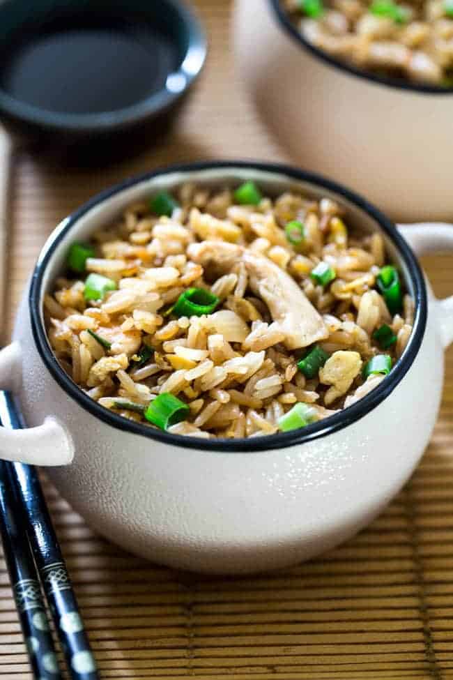 Easy Chicken Fried Rice - This chicken fried rice is better than takeout, and you can eat it without leaving your house! It's a quick, gluten free weeknight dinner that's always a crowd pleaser! | Foodfaithfitness.com | @FoodFaithFit