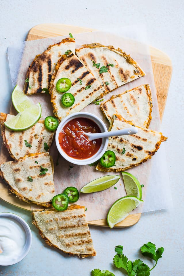 Grilled Mexican Lentil Quesadillas Overhead on a cutting board. Recipe on Foodfaithfitness.com