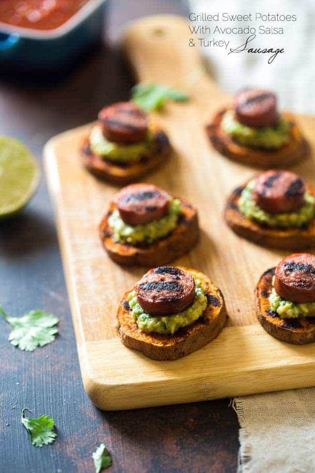 Spicy Grilled Sweet Potatoes with Avocado Salsa and Turkey Sausage - Grilled Sweet Potatoes are covered with creamy, smooth avocado salsa and turkey sausage for a quick, easy and healthy appetizer! Perfect for summer entertaining! | Foodfaithfitness.com | @FoodFaithFit