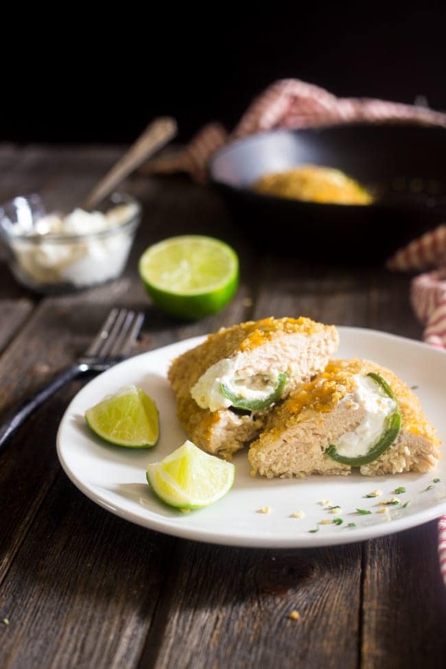 Quinoa Crusted Jalapeno Popper Chicken - This crowd-pleasing chicken tastes like the popular party food, but is made healthy and gluten free with a quinoa crust! Perfect for busy, weeknight meals! | Foodfaithfitness.com | @FoodFaithFit