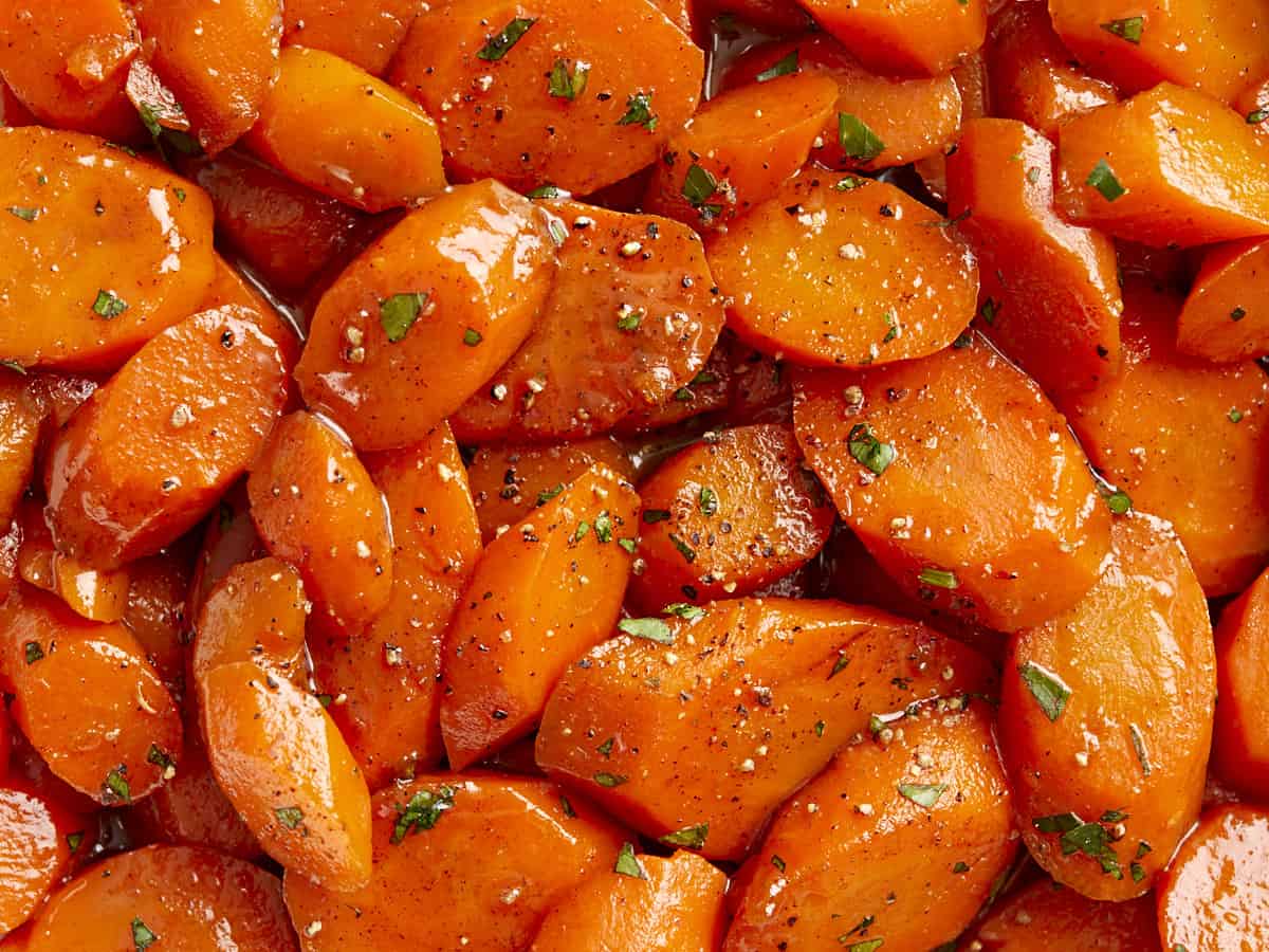 Very close up overhead view of glazed carrots.