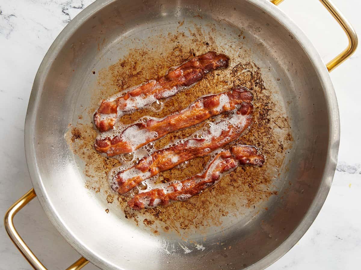 Cooked bacon in a large skillet.